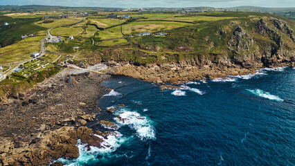 Aerial View of Rugged Coastline and Green Fields in Cornwall, UK