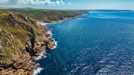 Aerial View of Rugged Coastline and Clear Blue Waters in Cornwall, UK