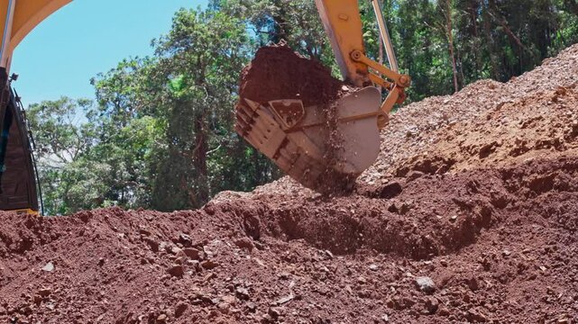 Slow motion video of an excavator being used in a construction project