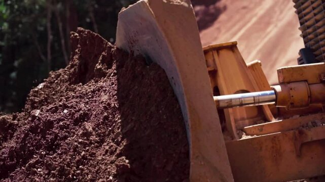 Slow motion video of a bulldozer are being used in road construction project