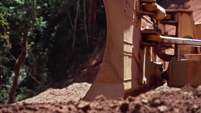 Slow motion video of a bulldozer are being used in road construction project