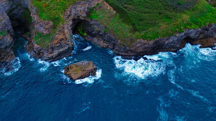 Aerial View of Rocky Coastline and Ocean Waves in Tintagel, Cornwall, UK