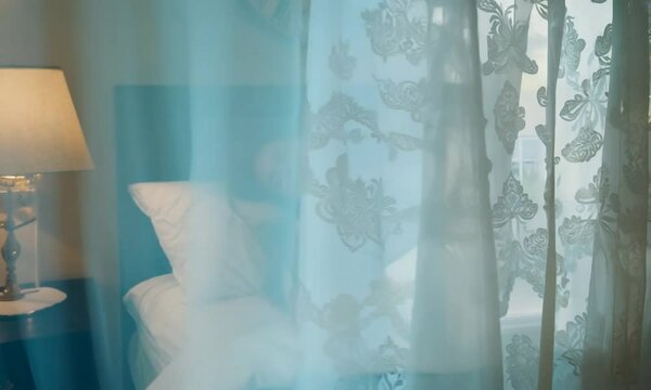 Peaceful Sleep of a French Woman in Cozy Bedroom Setting

