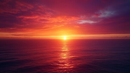 Obraz premium Inspirational quote set against a breathtaking sunset over the ocean, with deep orange and purple hues filling the sky.