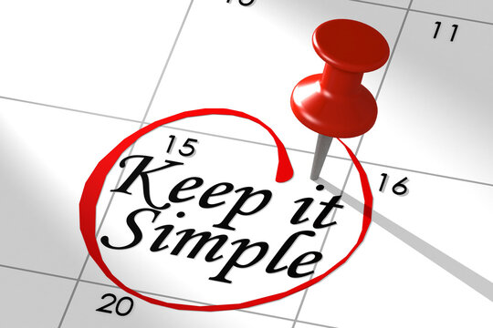 Keep it simple word marked on calendar with push pin