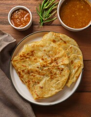 Golden brown flatbread on white plate