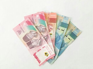 Rupaiah banknotes background. Indonesian money. stack of Indonesian banknotes one hundred thousand rupiah isolated on white background.