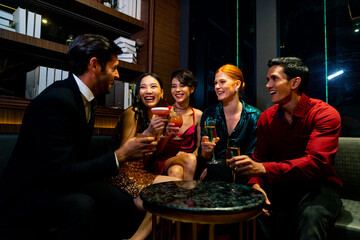 Group of Cheerful People toasting champagne glass celebrating holiday event party together at...