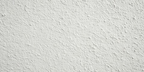 Fototapeta premium A textured white wall with a subtle grainy pattern, showcasing the rough beauty of a simple architectural element.