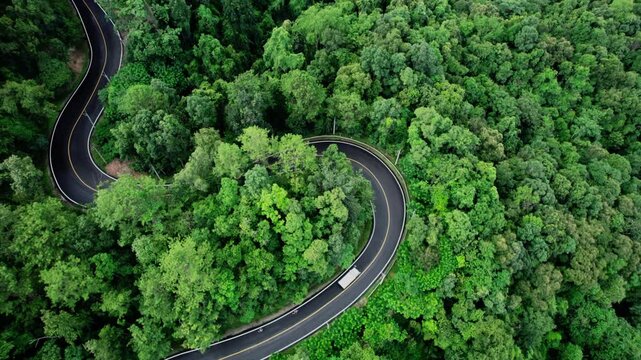 Aerial view of a road curve to Pai, ,High angle view of the forest road up the mountain to Pai, Mae Hong Son.
