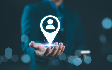 Targeted Marketing and Customer Strategy Concept. A person holds icon of a location marker with...