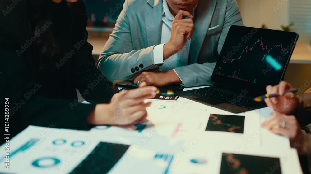 Aufkleber businesspeople collaborating in an office setting, analyzing financial charts and graphs, and using 