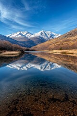 Serene Reflection Majestic Snow-Capped Mountains Mirrored in Clear Blue Lake, Tranquil Nature Landscape