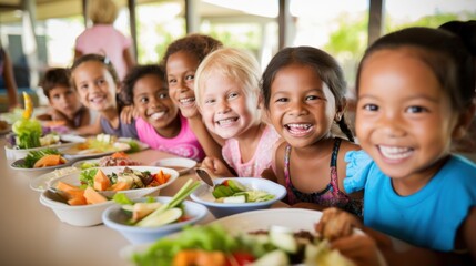A group of smiling children enjoys a vibrant meal together, exuding joy and camaraderie.
