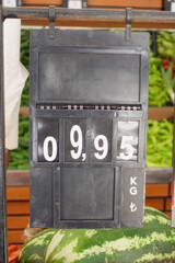 Obraz premium The Market Price Board for Watermelon is currently displaying a price of 0.99 per KG