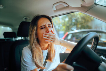 Fatigued Driver Yawning Feeling Sleepy Behind the Wheel. Exhausted woman driving all day feeling...