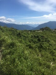 Naklejka premium Sunny and cloudy mountain scenery