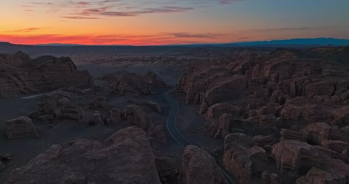 Asphalt road and spectacular yardan landform natural scenery at night. The famous Dahaidao uninhabited area natural landscape in Xinjiang, China.