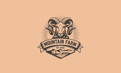 Fototapeta premium Mountain farm logo featuring a detailed ram's head and mountain landscape.