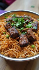 Close-up of a bowl of rice with meat and cilantro.