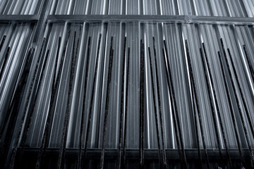 A construction site displaying a reinforced concrete foundation with steel rebar