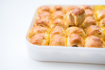 Selective Focus , Pineapple roll tart cookies or Nastar, in a box, isolated on white background.