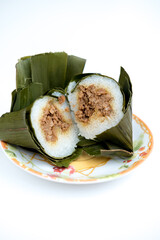 Arem-arem, an Indonesian-Javanese compressed rice cake, filled with minced meat 