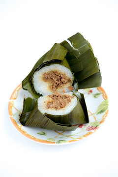 Arem-arem, an Indonesian-Javanese compressed rice cake, filled with minced meat 