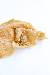 deep fried wontons or fried pangsit in Indonesian, on white background