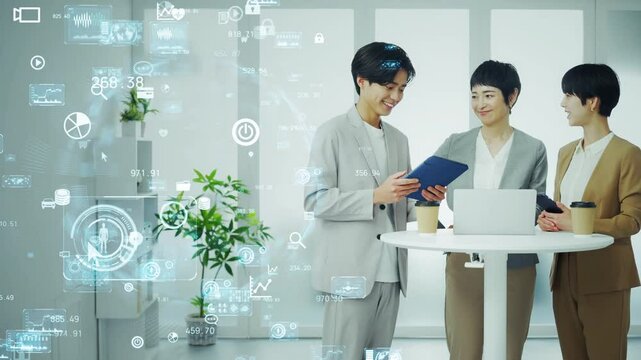 オフィスでミーティングするビジネスパーソンのグループとデジタルテクノロジー