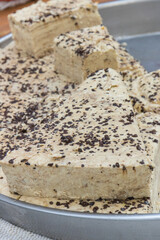 Halva with vanilla and chocolate on stall at bazaar. High calorie snack