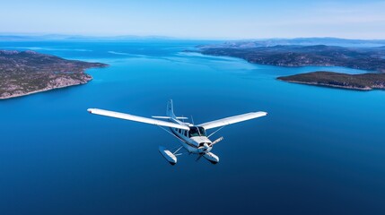 Naklejka premium Aerial view of a small airplane flying above a tranquil blue sea and islands.