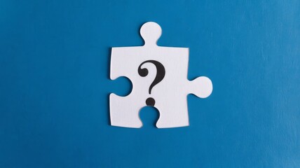 Top View of Question Mark on White Puzzle Piece, Contrasting with a Blue Background