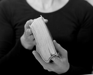 Naklejka premium praying with hand on bible learning christianity and the faith of God with people stock image stock photo 