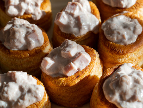 Homemade appetizer of voulevants filled with ham cream