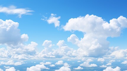 A deep blue sky with small, puffy clouds