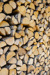 stacked pile of cut fry firewood for winter