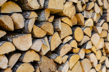 stacked pile of cut fry firewood for winter