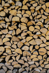 stacked pile of cut fry firewood for winter