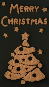 Loop zd animation with a Christmas theme. An image of a Christmas tree and the text: Merry Christmas appears on a dark night canvas background. Vertical 3d Christmas animation