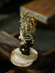 Black candle with herbs, wormwood, St. John's wort., tools for ritual concept photo. Dark witch...