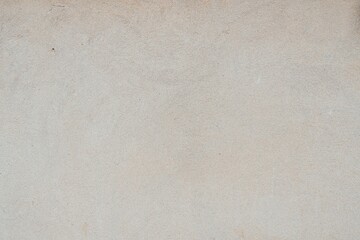 Textured Plaster Wall Background. A close-up of a textured plaster wall with an abstract rough...
