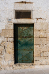 Old authentic vintage closed front door in Ostuni, Puglia, Italy