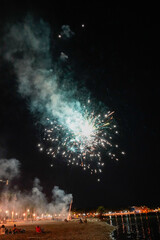 fireworks, in summer, next to the beach on the festival of the Virgin of August
