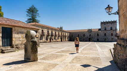 Obraz premium Tourist woman walking through the main square of the monumental city of Cambados, Pontevedra.