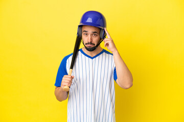 Young caucasian man playing baseball isolated on yellow background thinking an idea