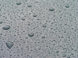 Water Droplets on Smooth Light-Toned Surface