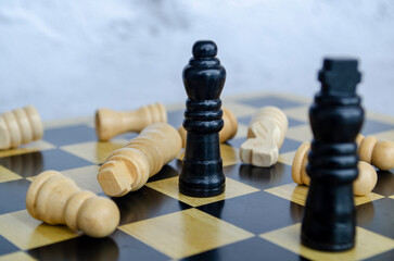 The Kings and Queens clash in a battle of wits. Chess battle concept
