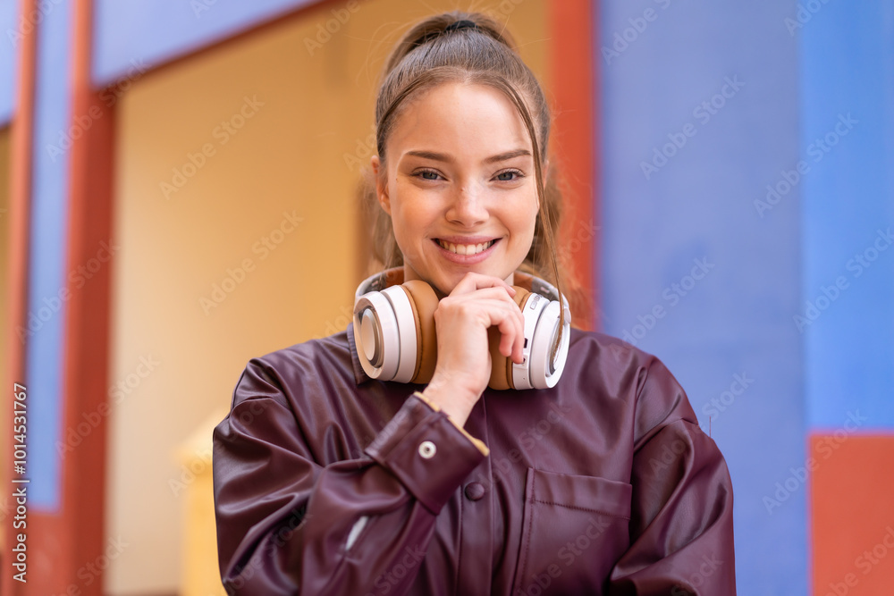 Poster Young pretty girl at outdoors With happy expression