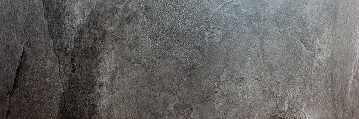 Panoramic image. Black gray uneven stone background